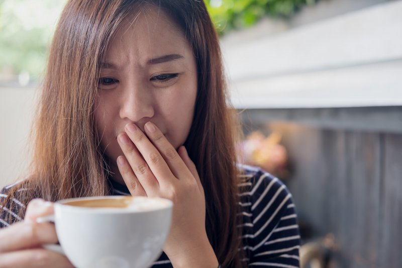 woman tasting something bitter in her mouth