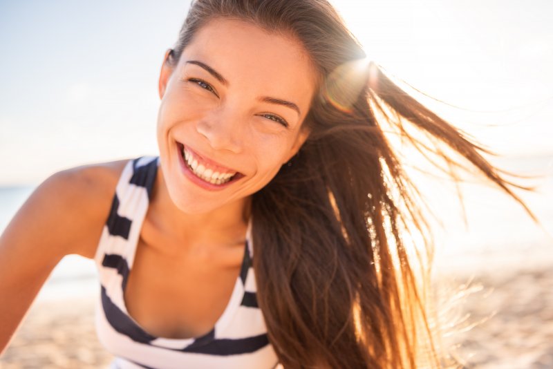 young woman smiling during summer