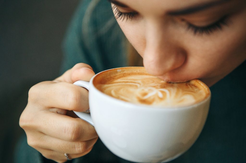 Closeup of woman drinking coffee