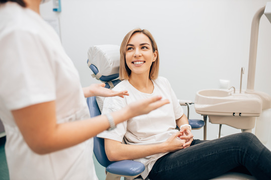 patient talking to a family dentist 