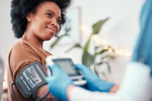 woman having her blood pressure taken